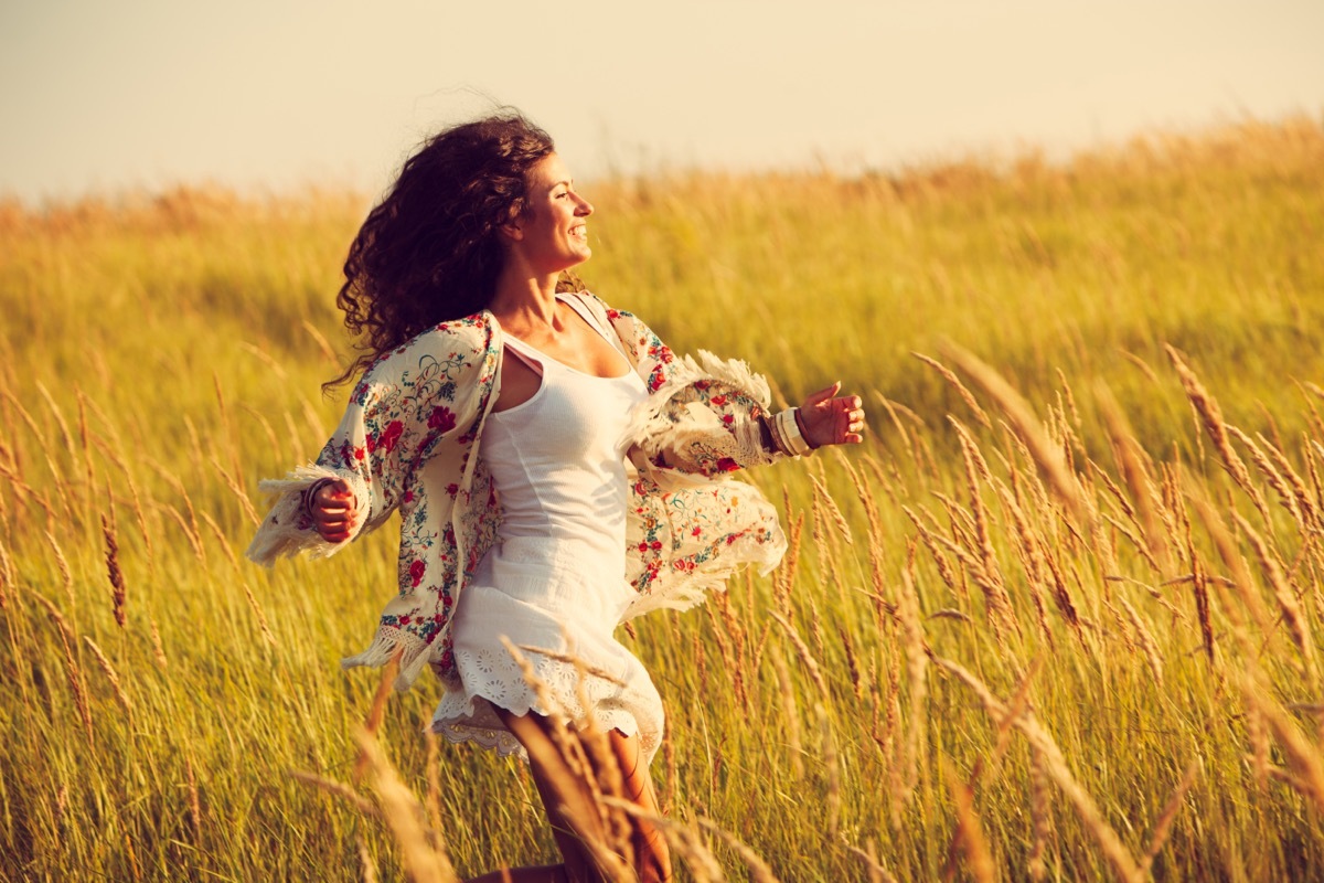 Woman Running in a Field