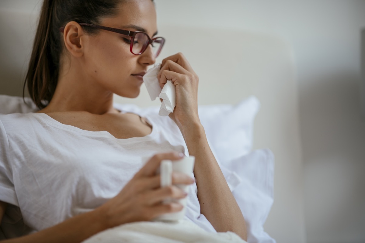 Young woman having flu