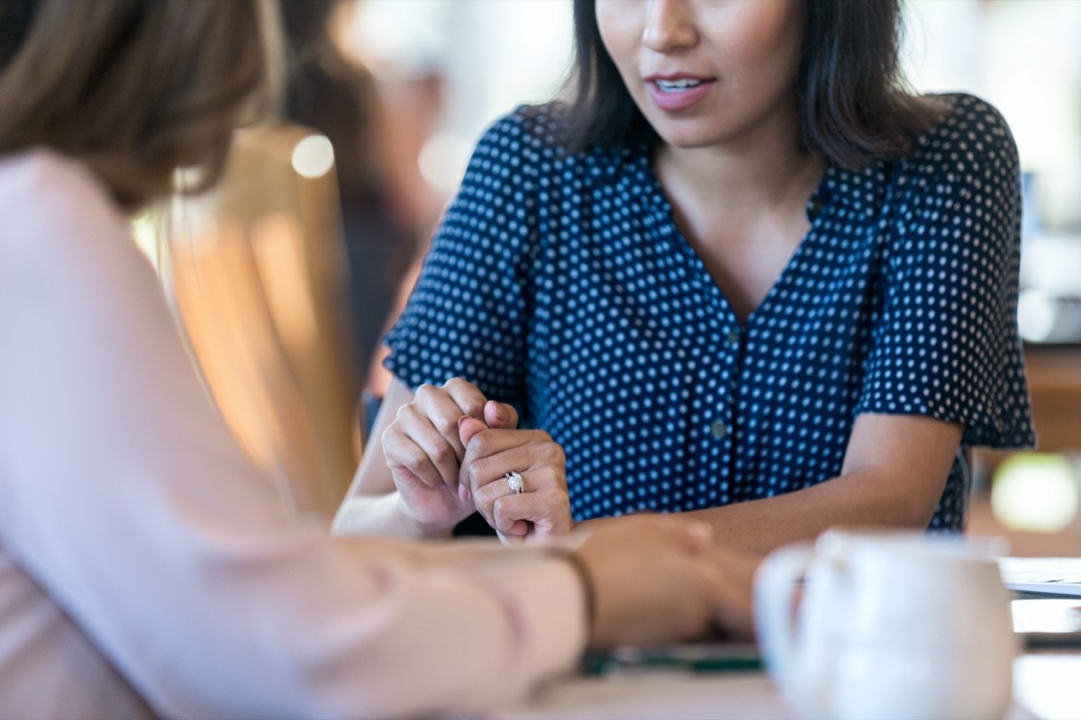 Mid adult woman is nervous during the interview for a management position.