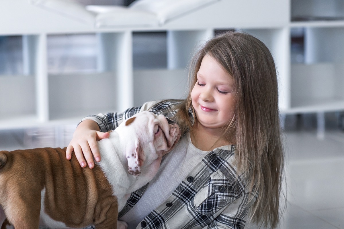 Little girl with bulldog