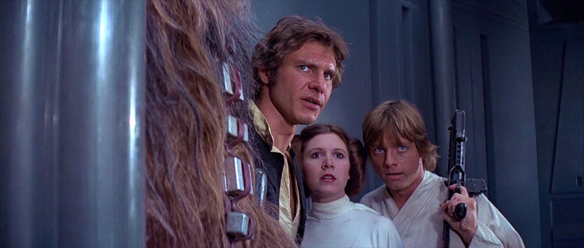 Harrison Ford, Carrie Fisher, and Mark Hamill in Star Wars (1977)