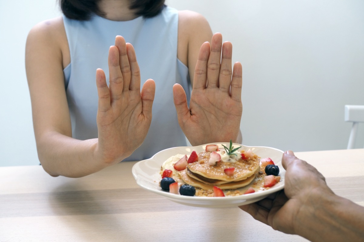 not hungry woman refusing food