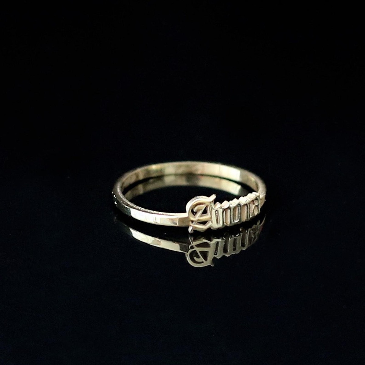 Gold gothic name ring, black background