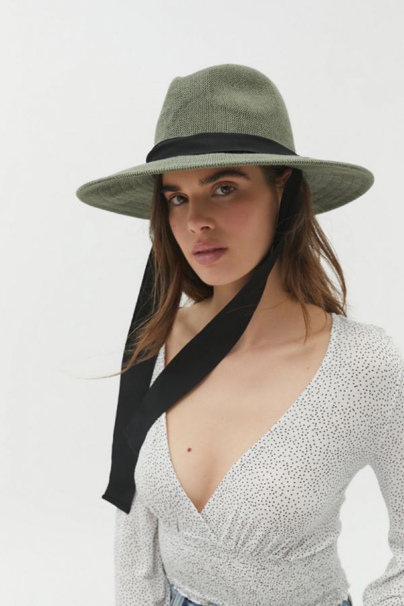 white woman in green panama hat