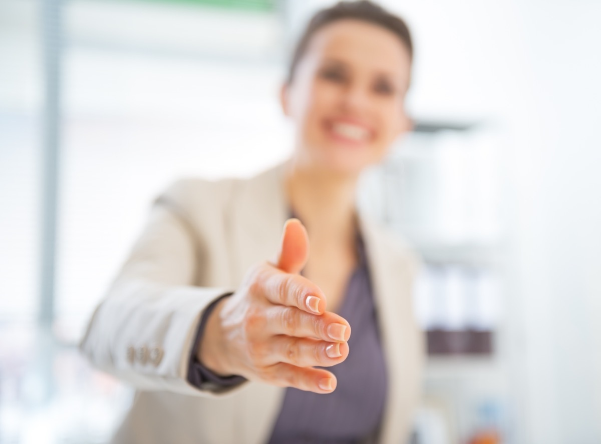 business woman stretching her hand for a handshake