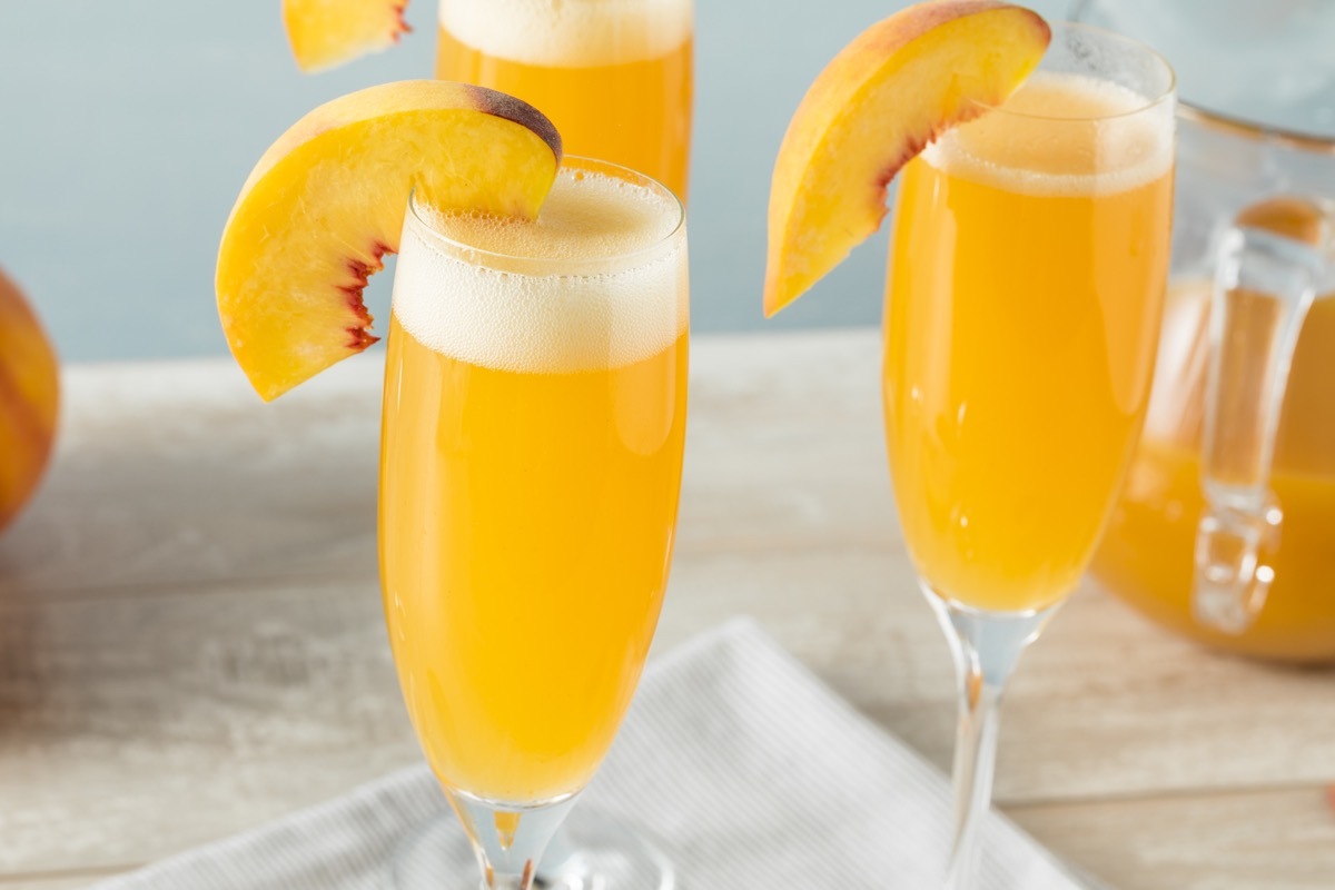 bubbly bellini cocktail with a peach