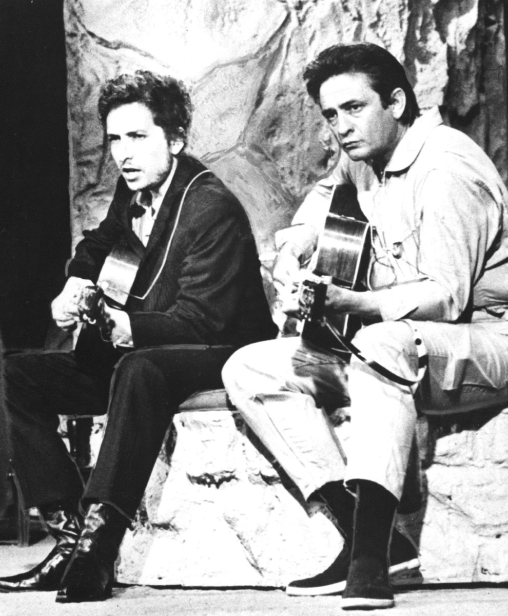 Bob Dylan and Johnny Cash sit on stage together and perform in 1969, songs turning 50