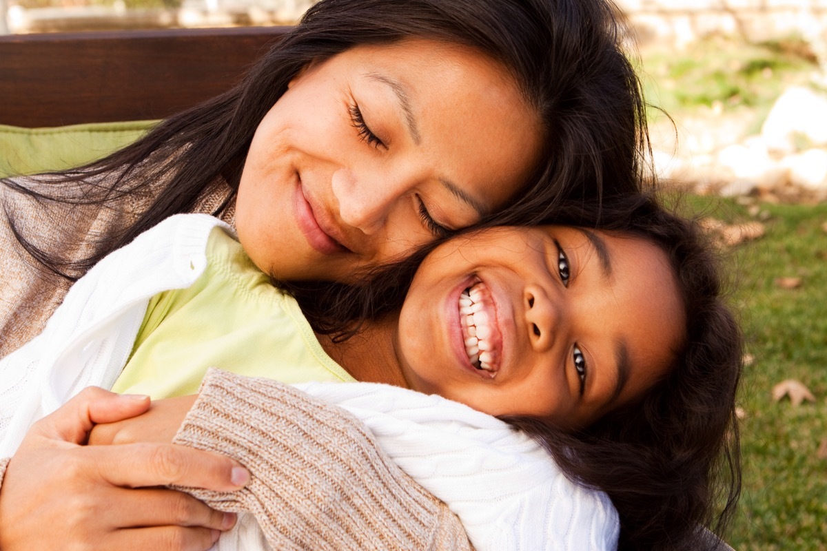 Mother and daughter smiling