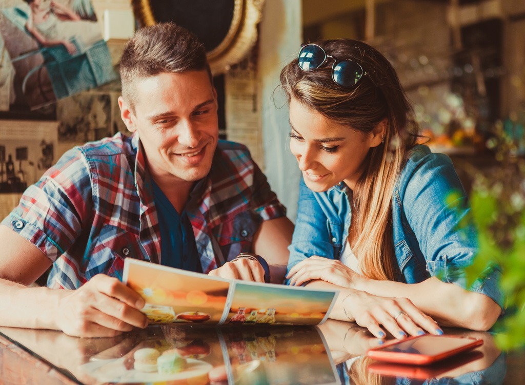 Couple reading restaurant menu