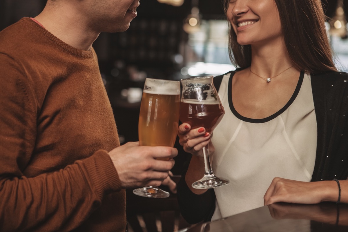 a couple drinking beers at a craft brewery, date night ideas