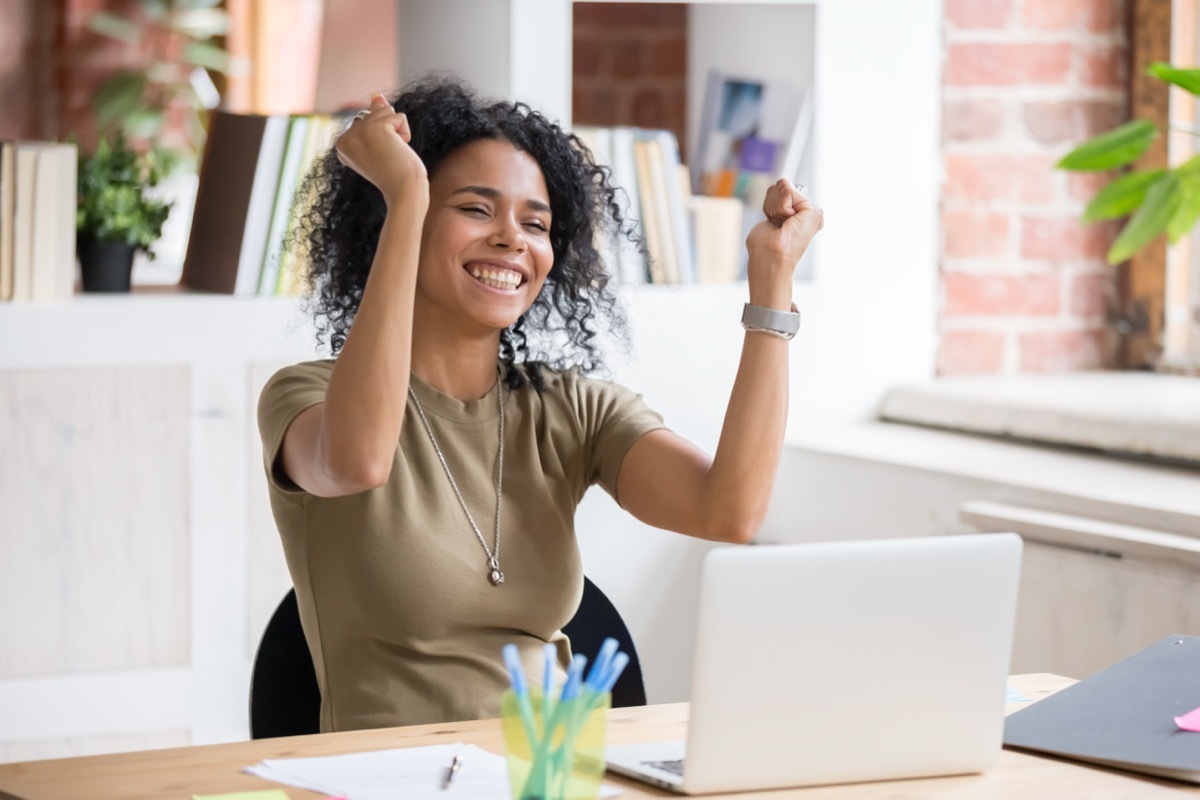 Enthusiastic Black Woman in Office