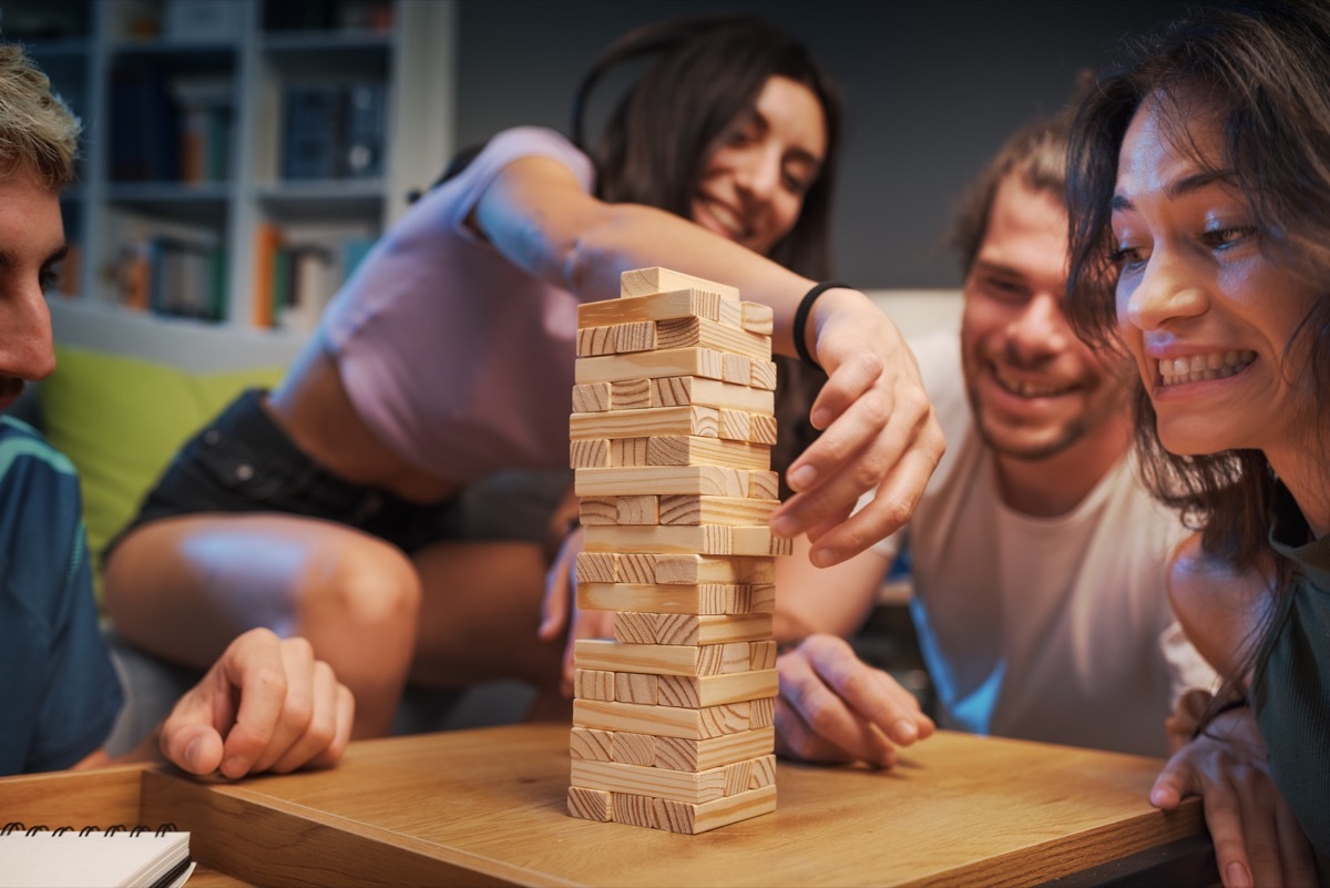 group of friends playing jenga