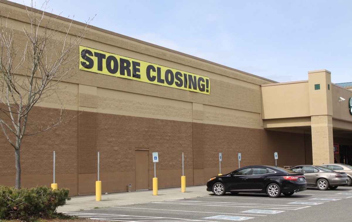 A store closing sign on a grocery store that is closing because on corporate mismanagement