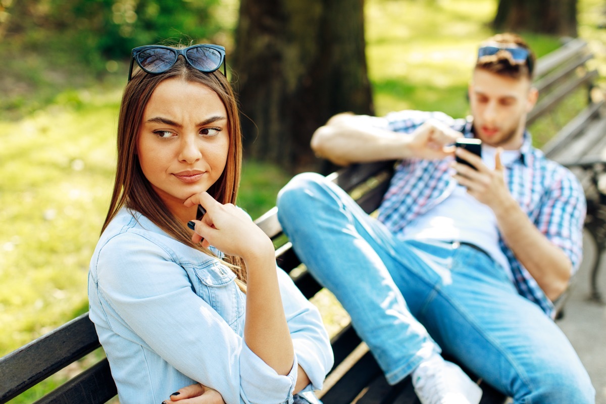 Man using his phone in the middle of a date