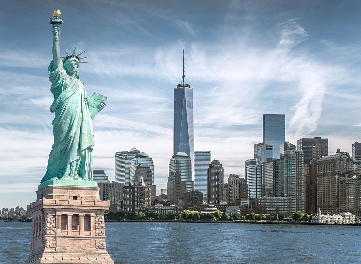 New york city skyline with statue of liberty and one world trade center