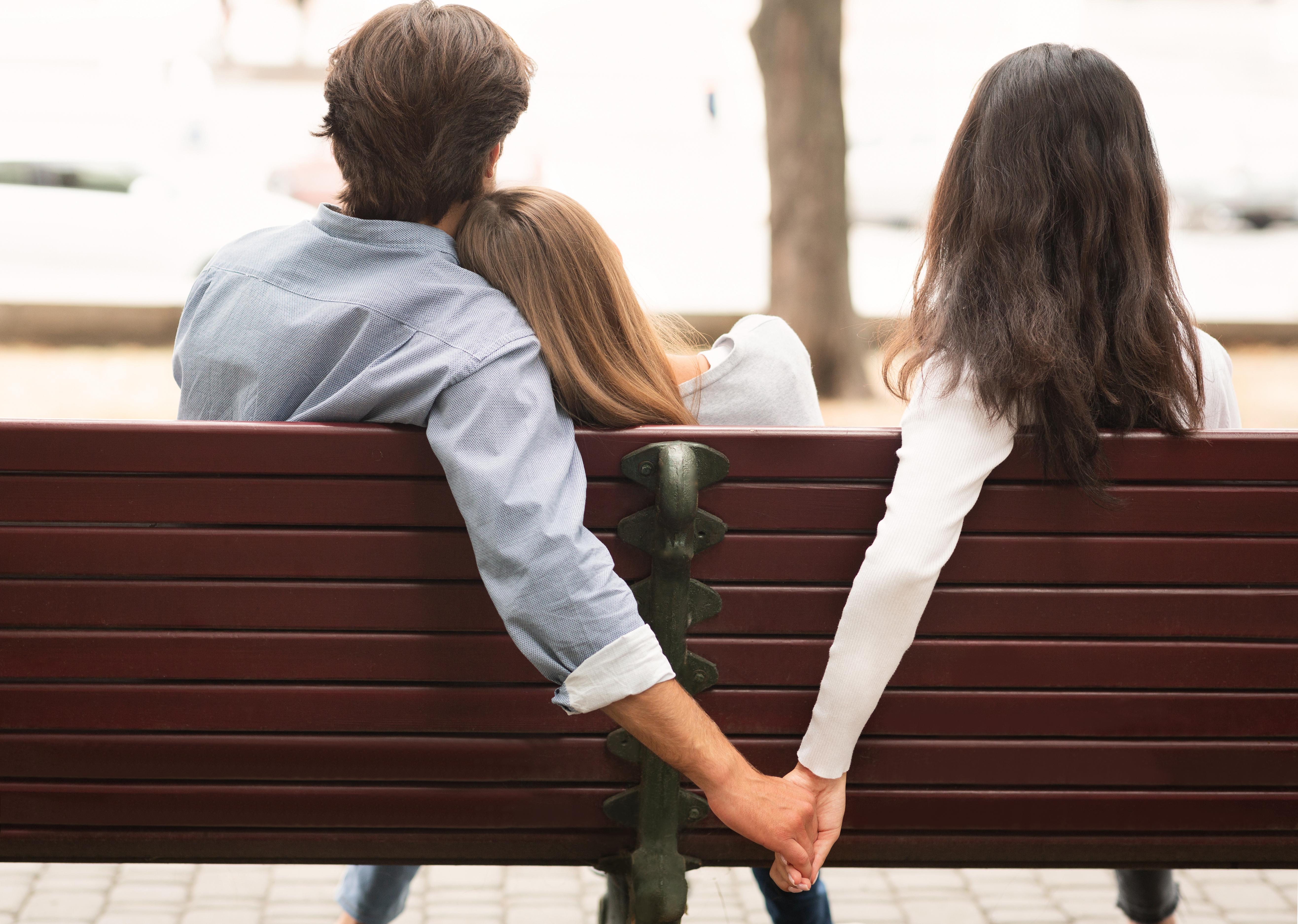 love triangle on a park bench