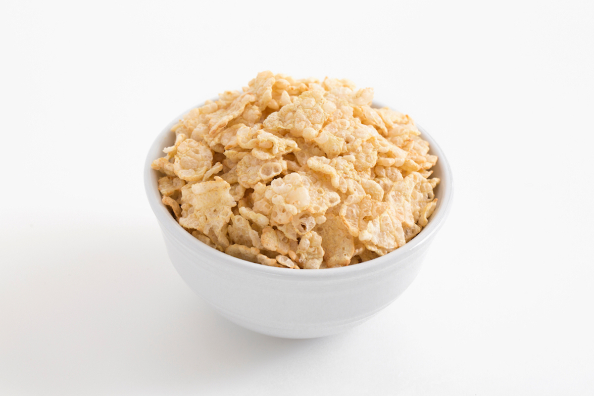 white bowl filled with special k on isolated white background