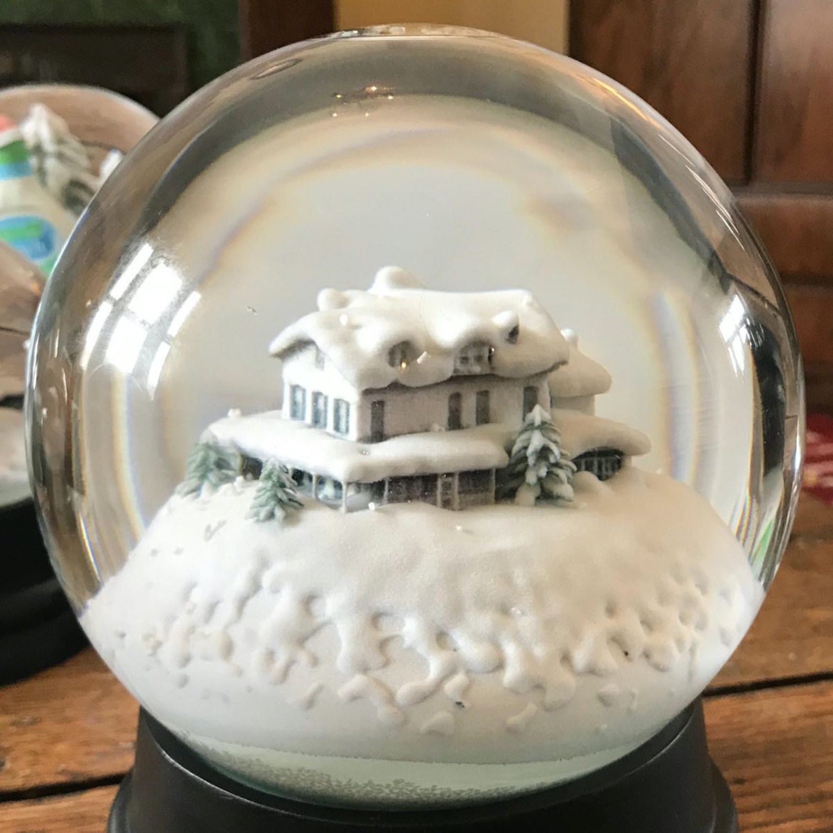 snow globe with white house in it