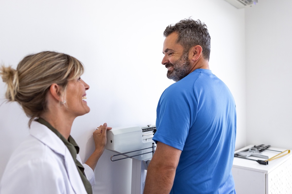 man talking to doctor about weight loss