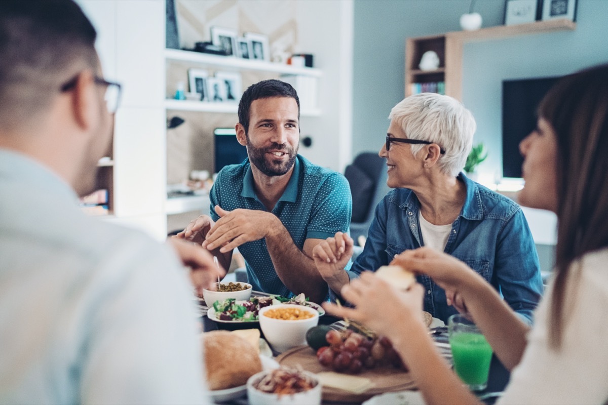 Family talking over dinner.