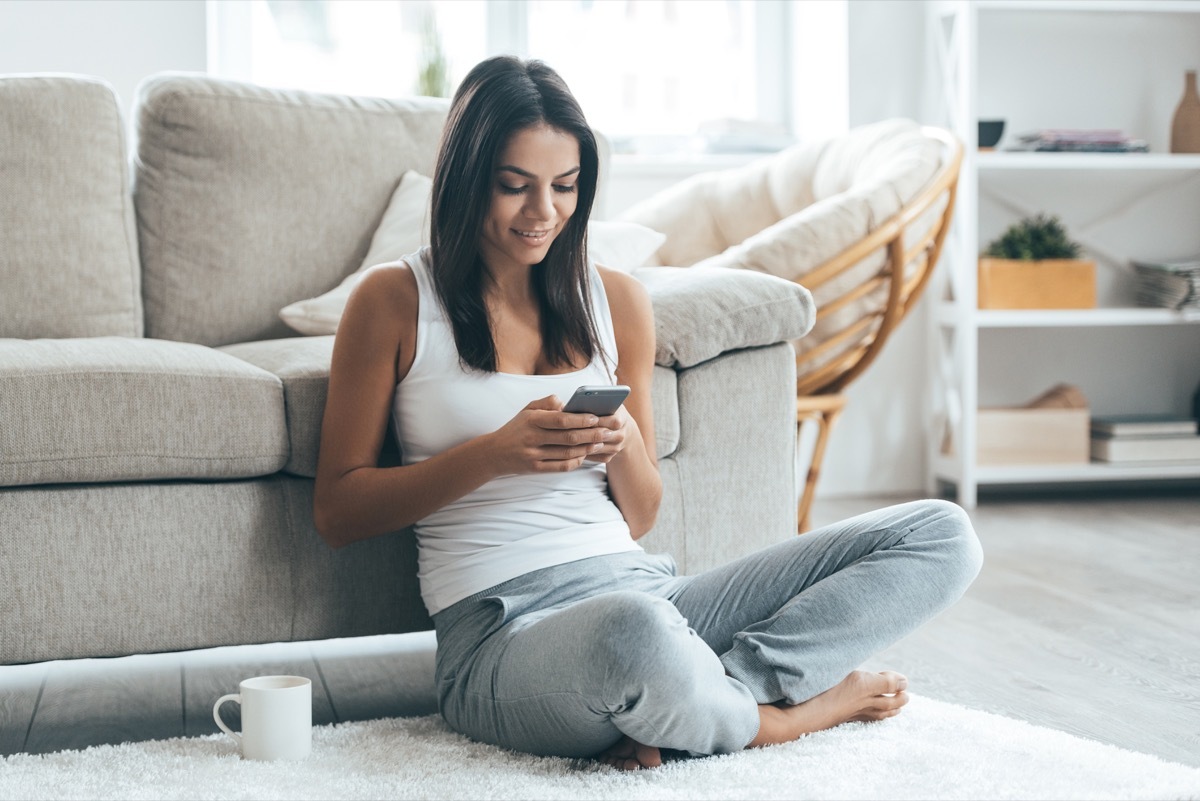 Woman using a dating app on her phone