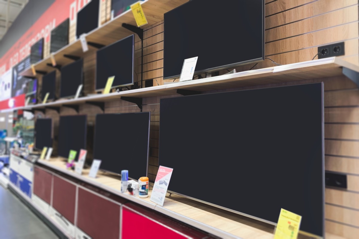 tvs on shelf at store