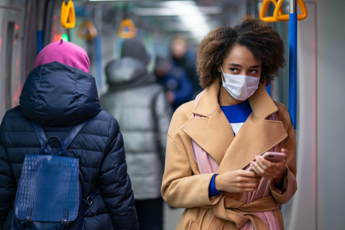 Woman in a medical mask in subway/