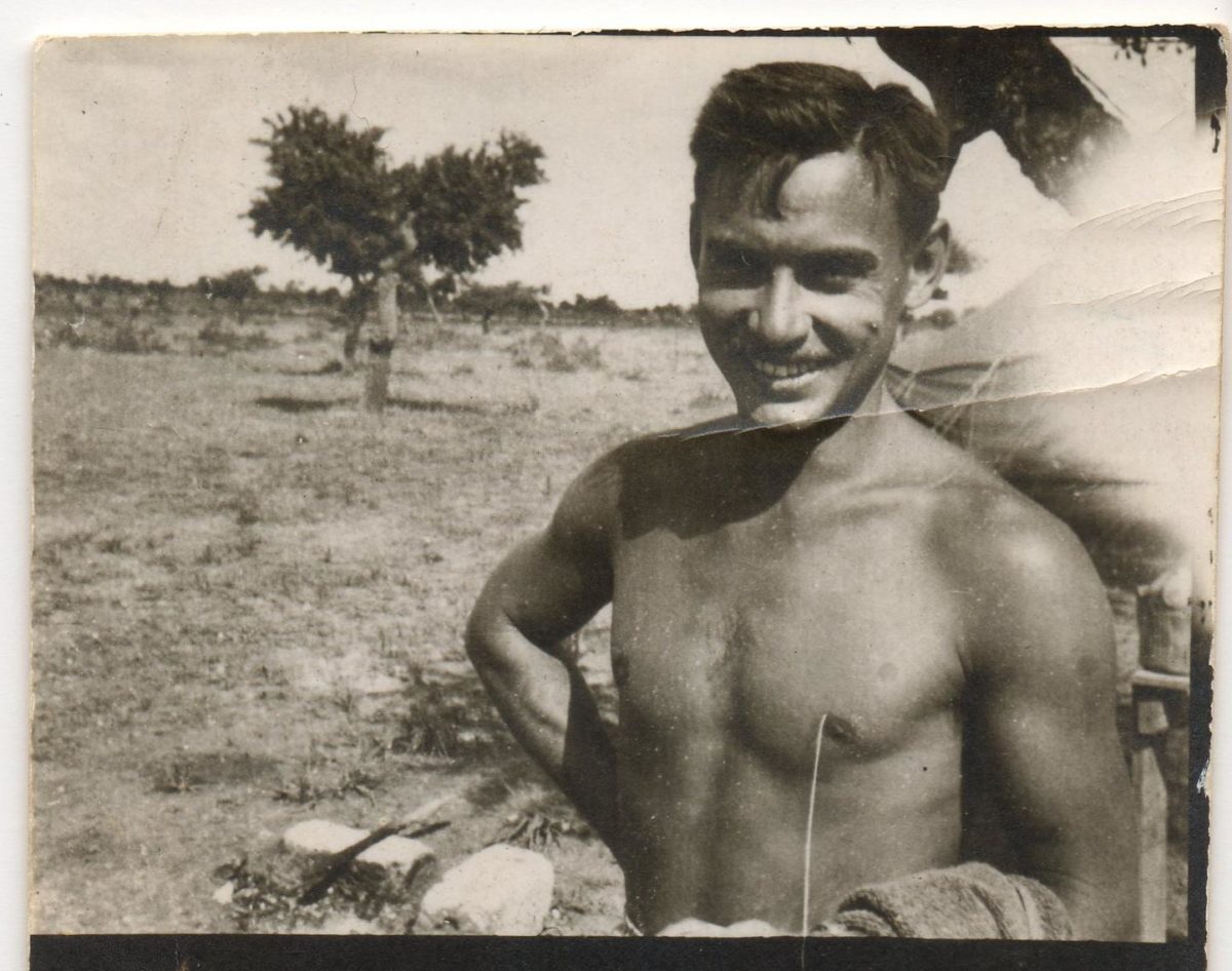 1940s black and white photo of shirtless man