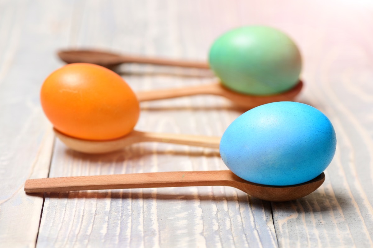 kids playing a spoon and egg race - best easter games