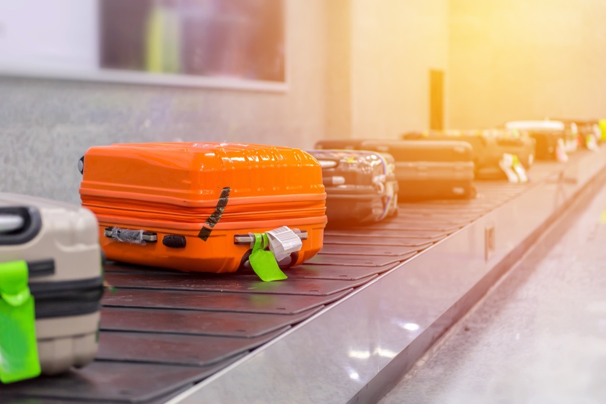 luggage on carousel at airport