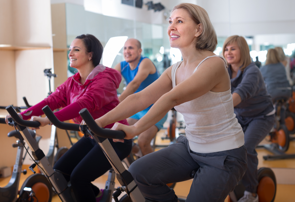 Older Woman on Exercise Bike Anti-Aging