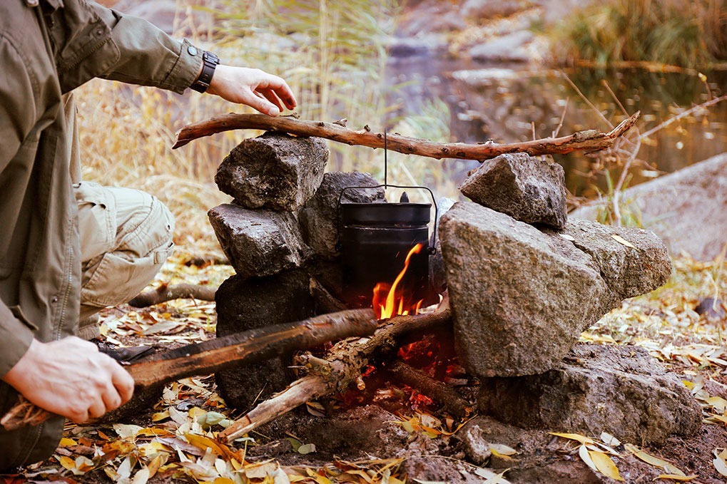 man campfire marshmallows