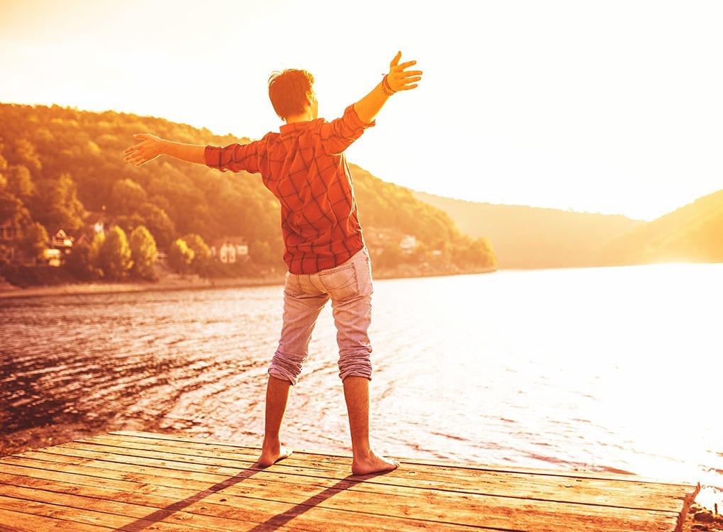 man standing on dock