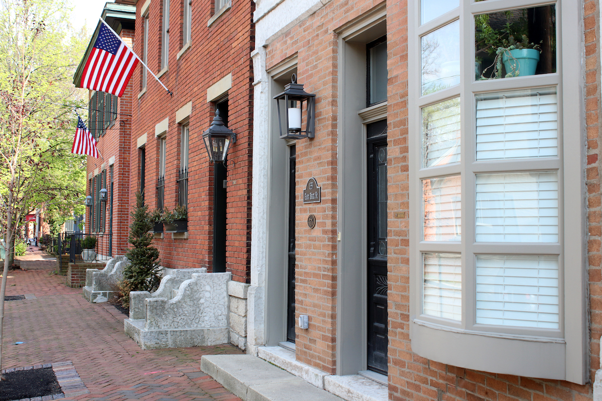 A row of brick houses and brick sidewalk in German Village in Columbus Ohio