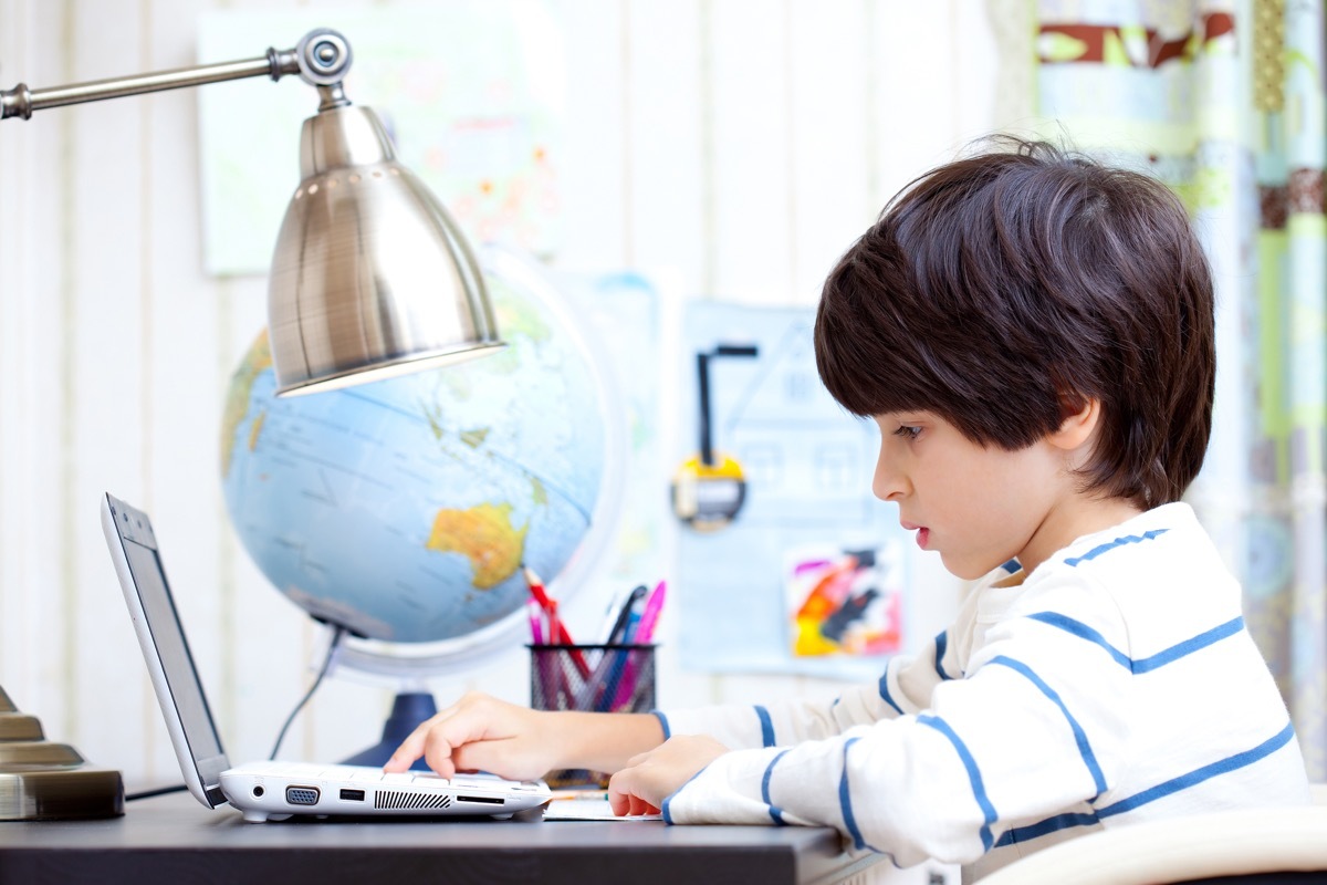 Child Doing His Homework on the Computer ways going back to school is different