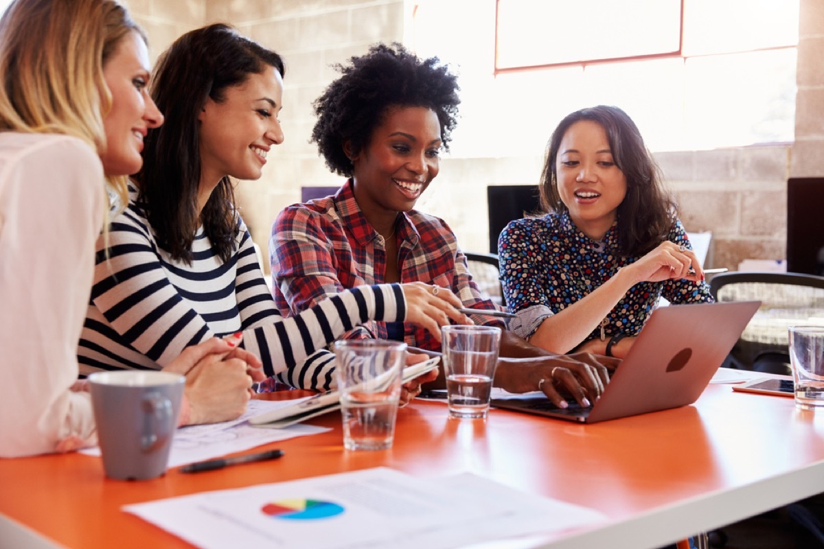 women working together at a table, office etiquette