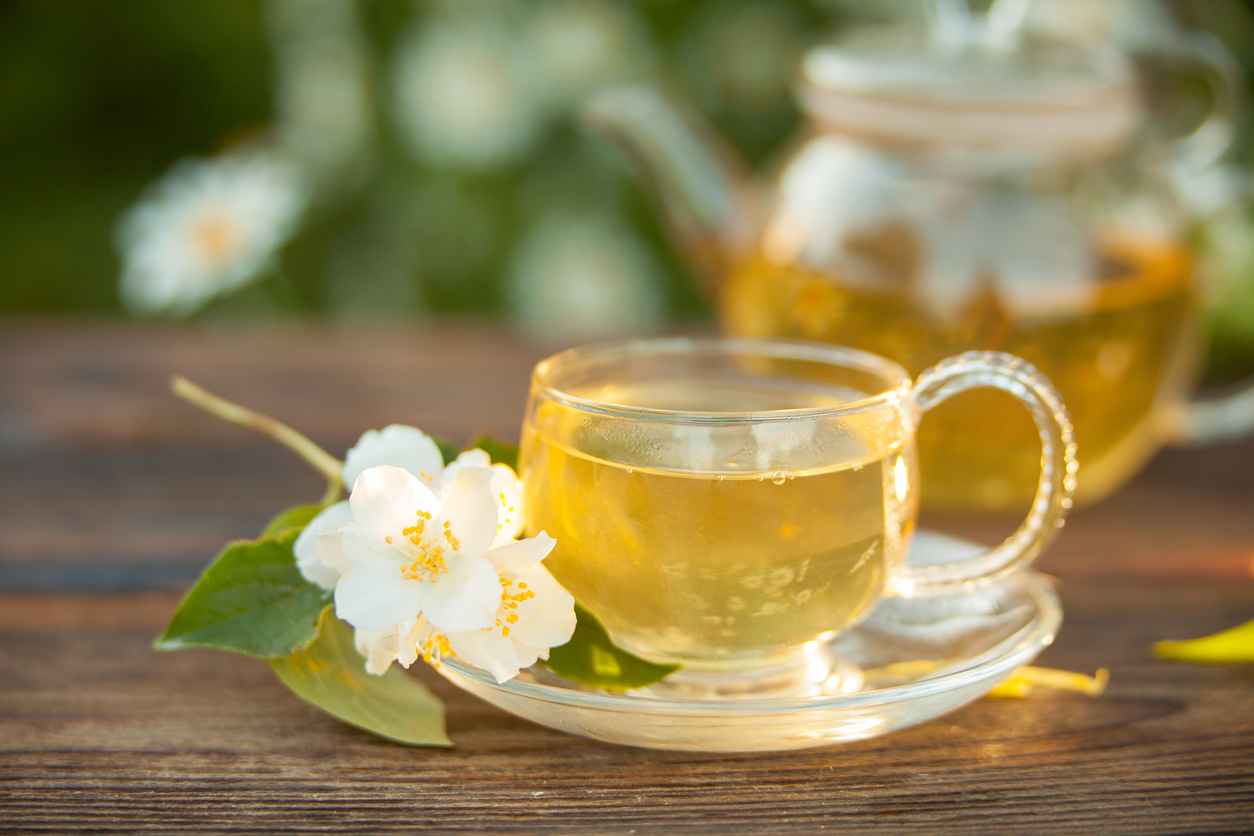 delicious white tea in a beautiful glass bowl on a table