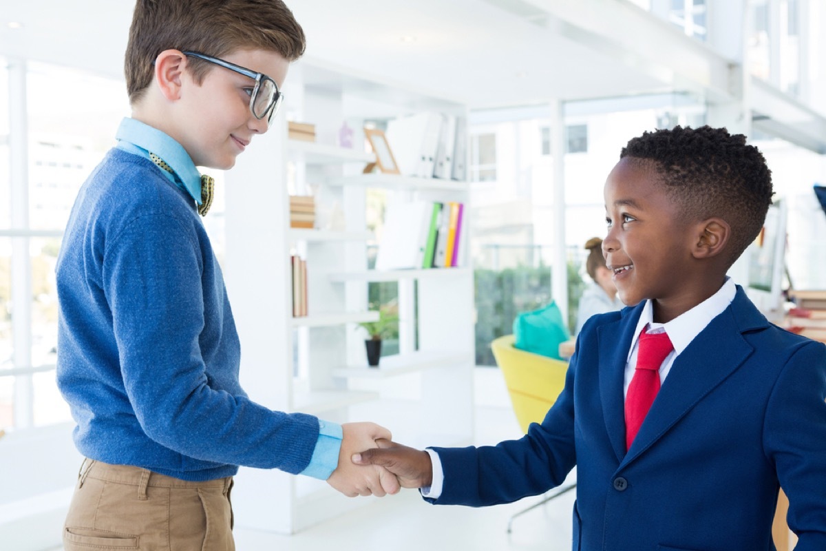 two young boys shaking hands, skills parents should teach kids