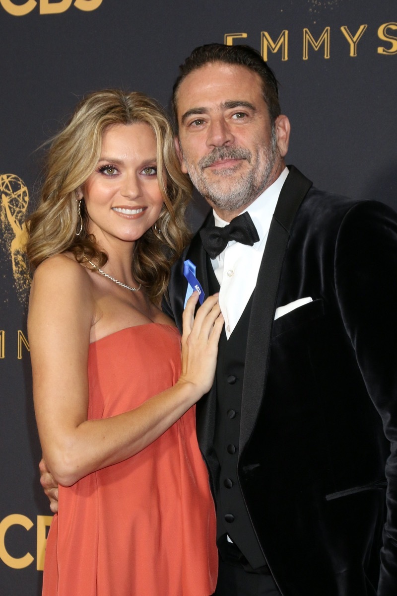 Hilarie Burton wears an orange dress and Jeffrey Dean Morgan wears a black suit at Primetime Emmy Awards in 2017