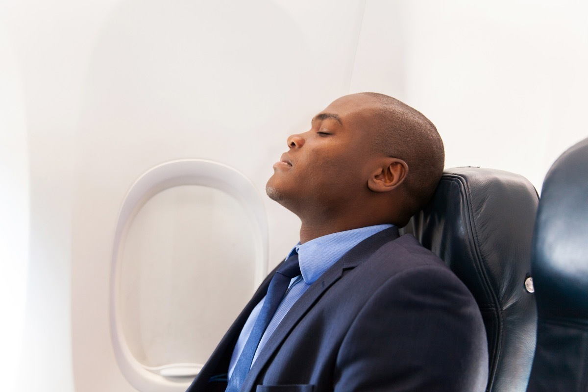 Man sleeping on an airplane