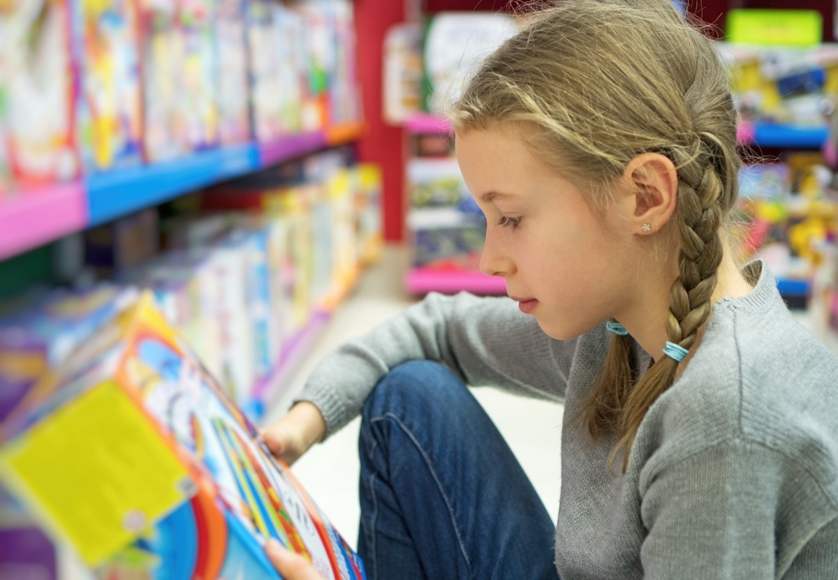 little girl shopping at toy store