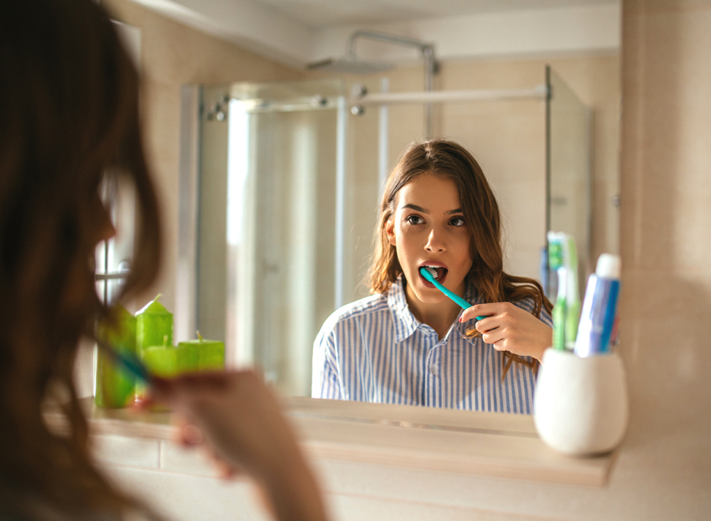 Woman brushing teeth