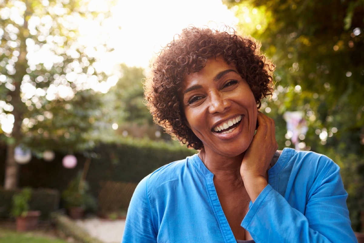 smiling black woman outside in the sun