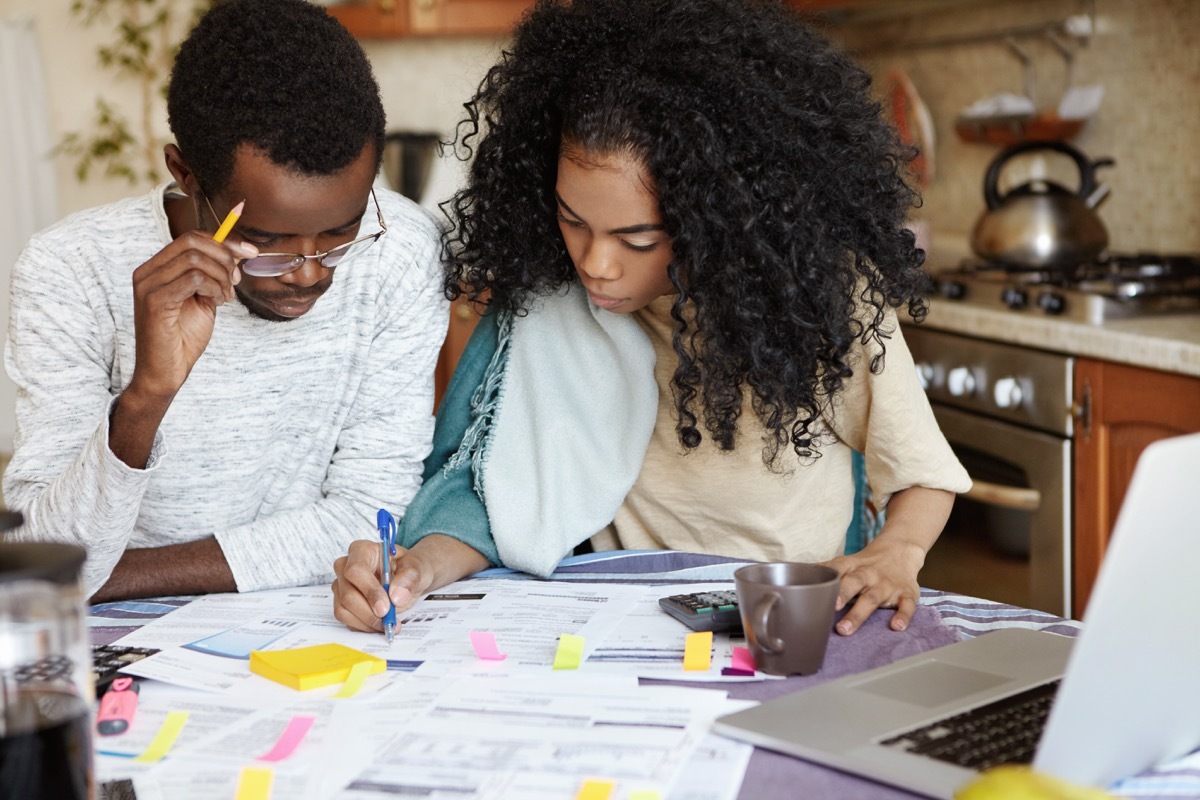 couple looking over a financial budget for home renovations