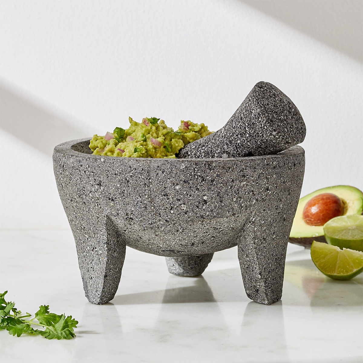 mortar and pestle with guacamole in it