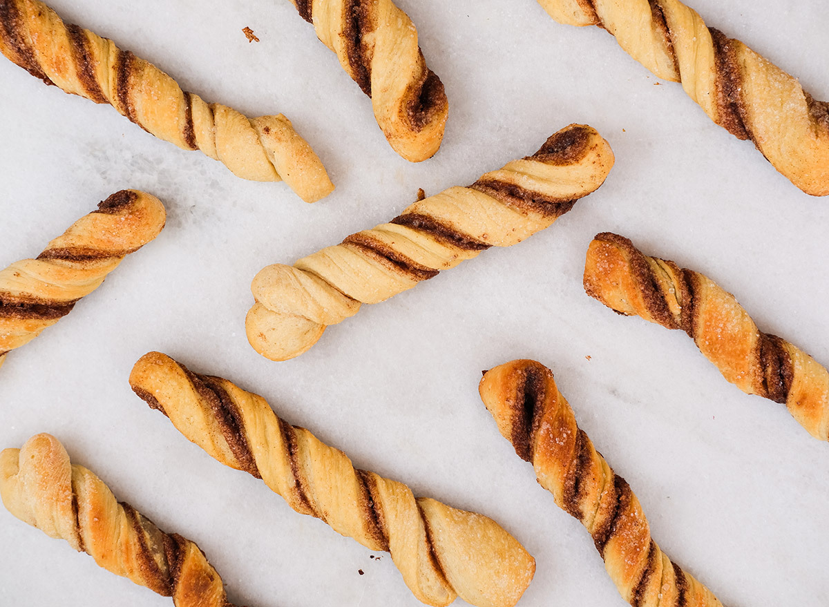 cinnamon twists made from pizza dough on a marble counter