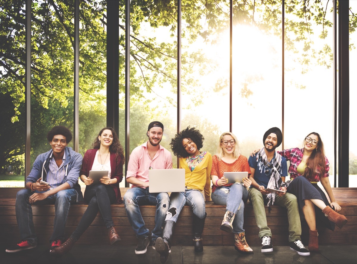 college students sitting on a bench