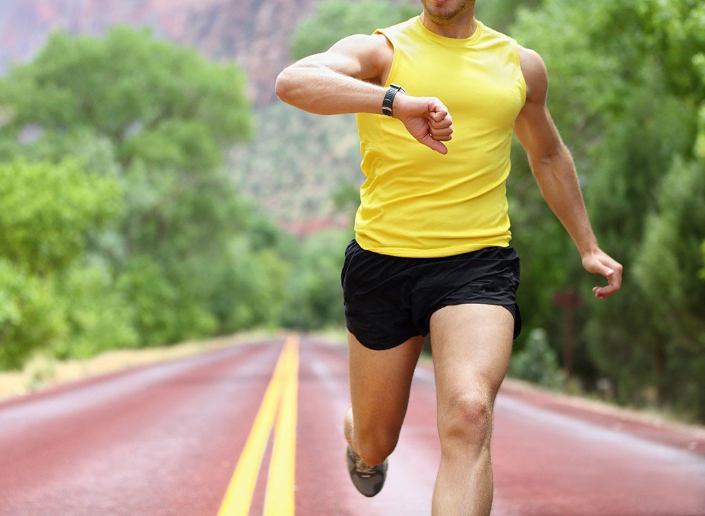 man running checking watch