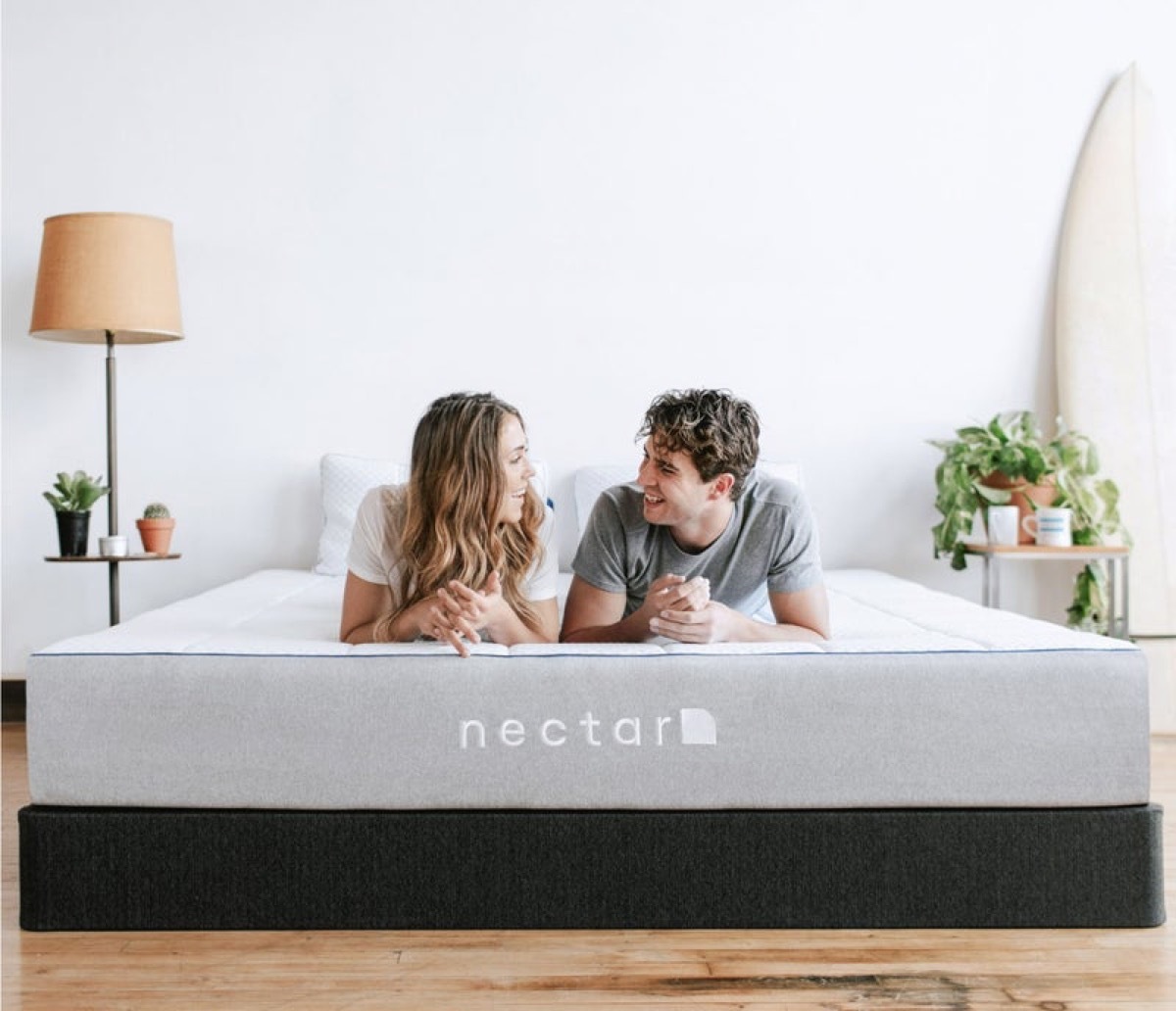 Couple talking on new mattress