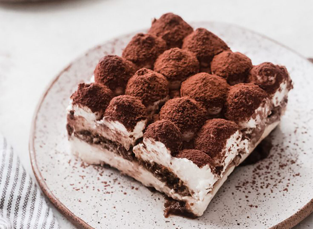 slice of tiramisu dusted with cocoa powder